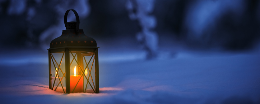 Lantern lit and sitting in the snow