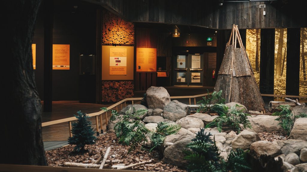 A view of the central motif at Sainte-Marie, including some stones, ferns and a wigwam