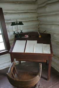 papers at a desk inside the Office of the Clerk-in-Charge