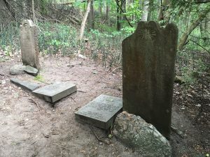 Graves stones of two soldiers and a young girl