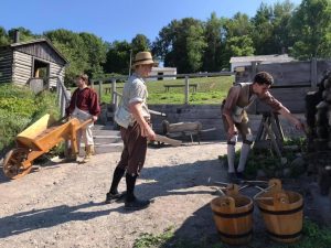 three men working in the dockyard