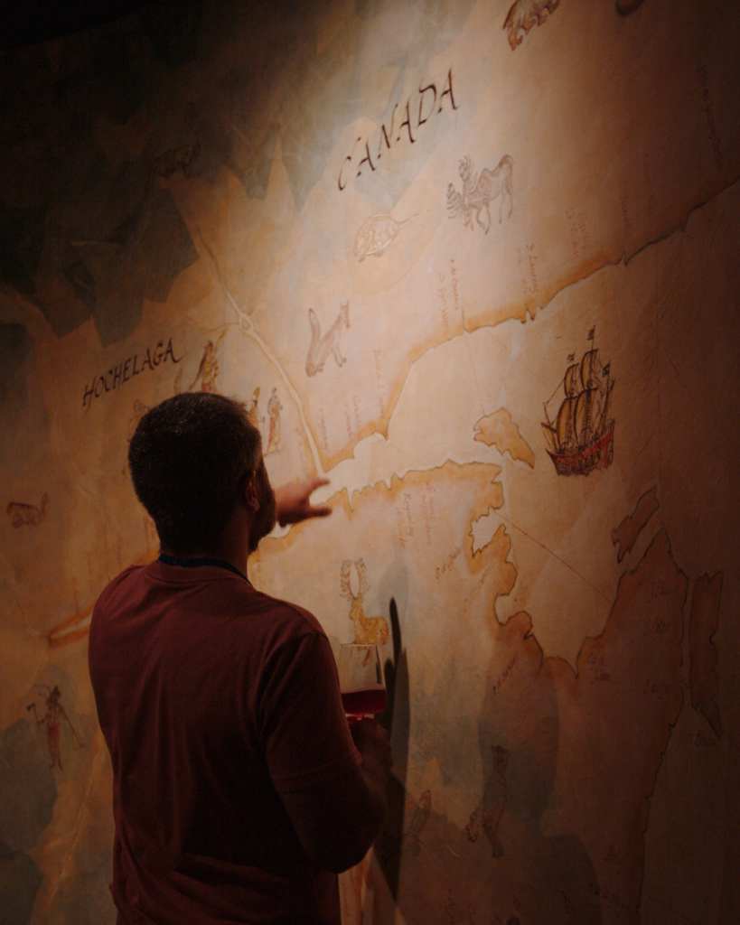 32 Guest looks at map on wall in museum