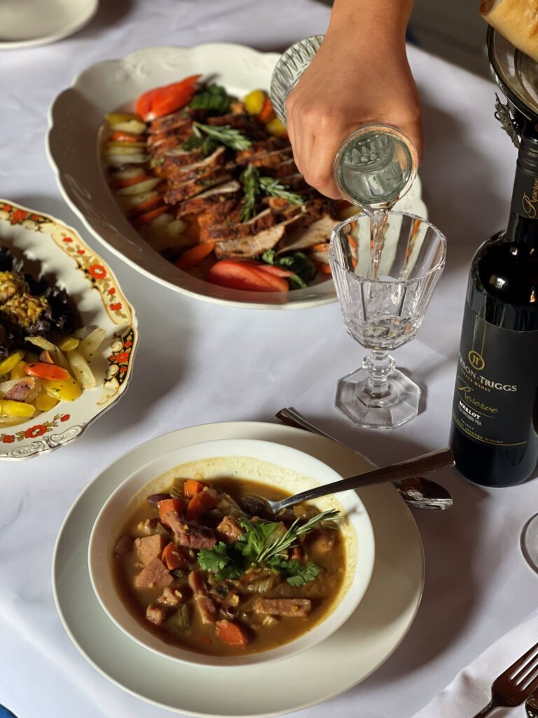 Water poured into a glass on a set table