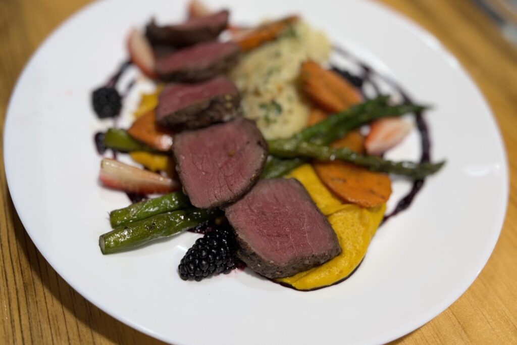 Venison course offered as part of Shadows and Stone featuring medium rare cuts, as well as mash, roasted veg and squash puree