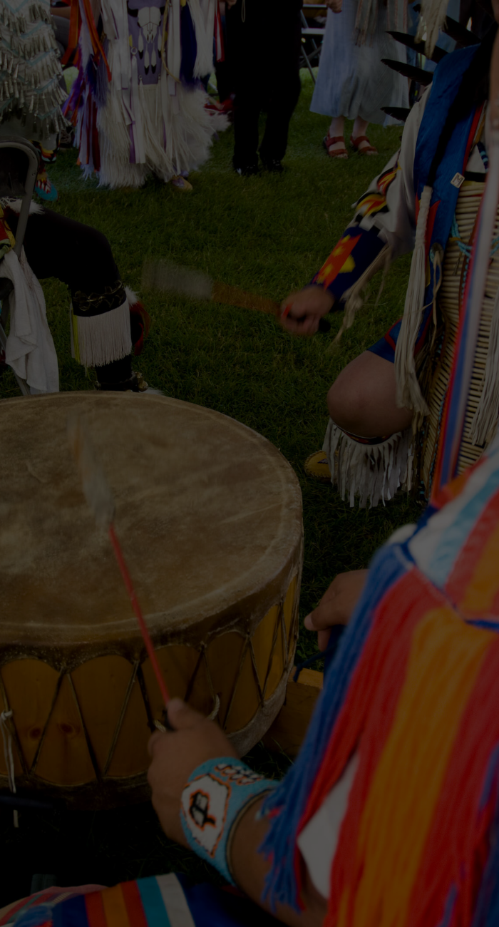 indigenous dancer twirling in traditional first nations clothing